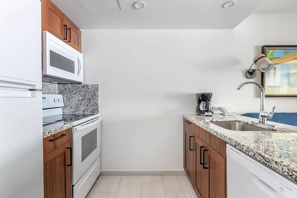 Whip up easy meals in the polished kitchen with granite counters.