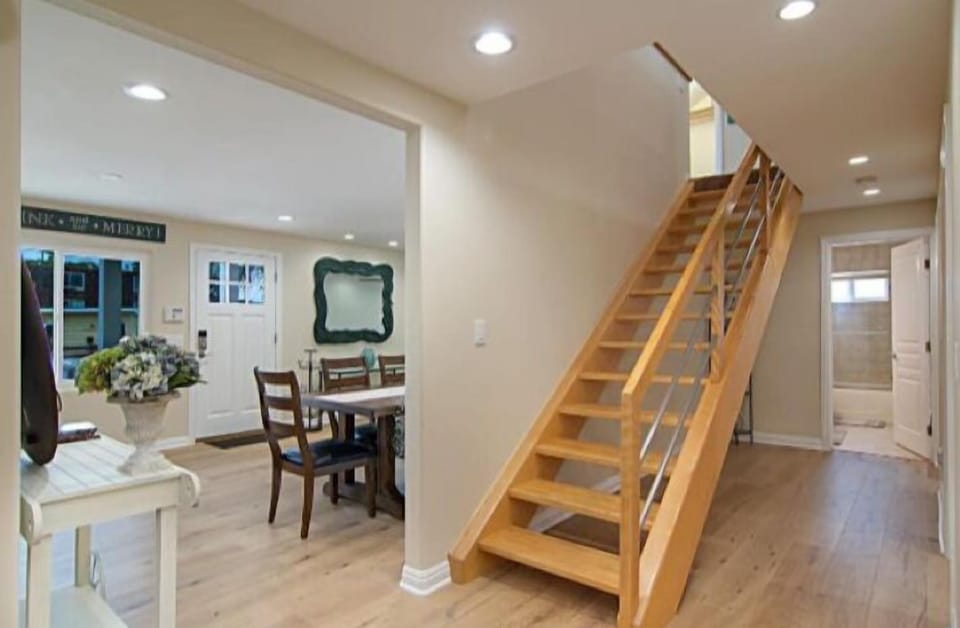 Downstairs View of LR/DR/Front Door-Hallway BA & Staircase to Open Loft above.