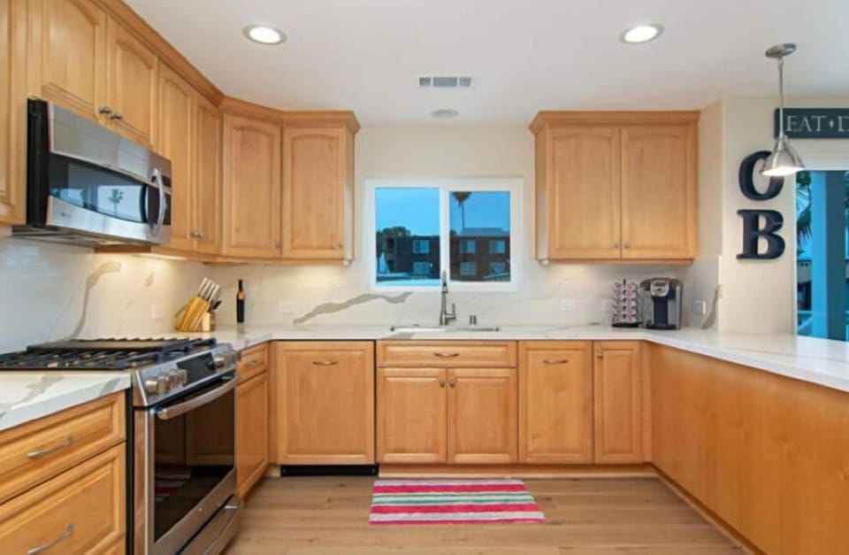 Downstairs, Fully equipped Kitchen w/Counter seating open to Living & Dining.