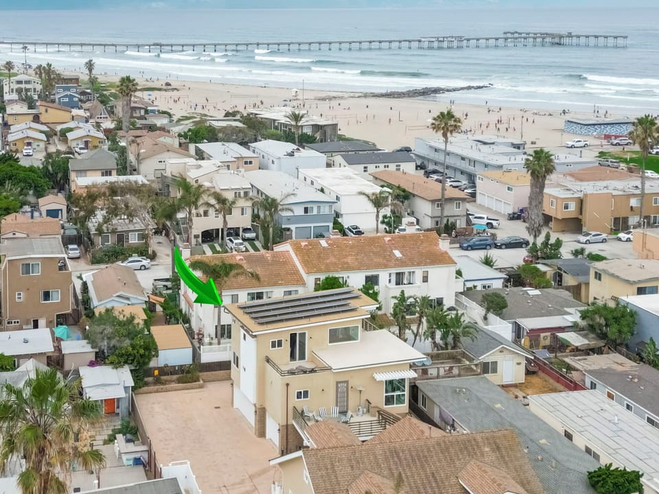 Aerial View of back property in Center/Front w/Beach & Ocean just steps away.
