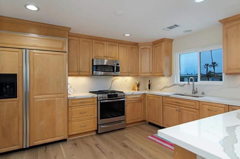 Downstairs Kitchen w/Range, Microwave, Dishwasher & Refrigerator.