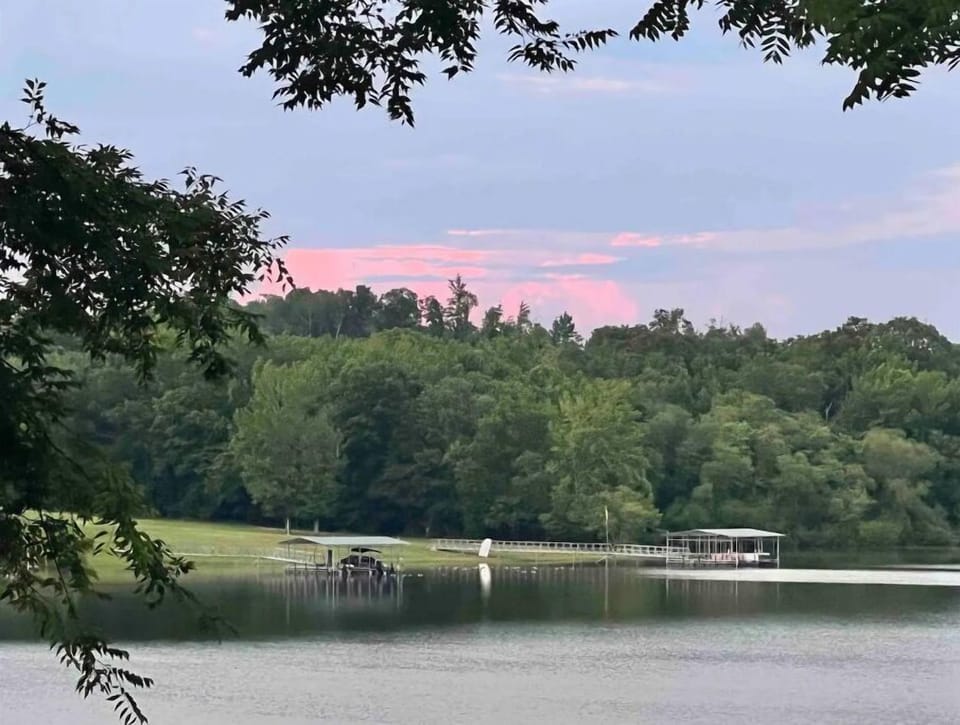 Lovely sunsets over the trees and water.