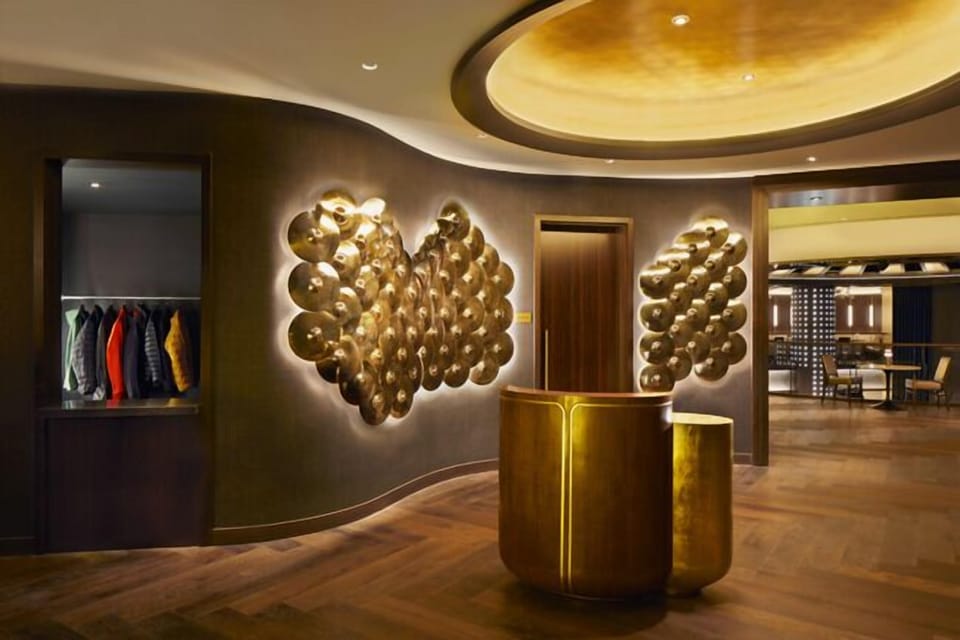Step into a dramatic lobby with glowing sculptural art.