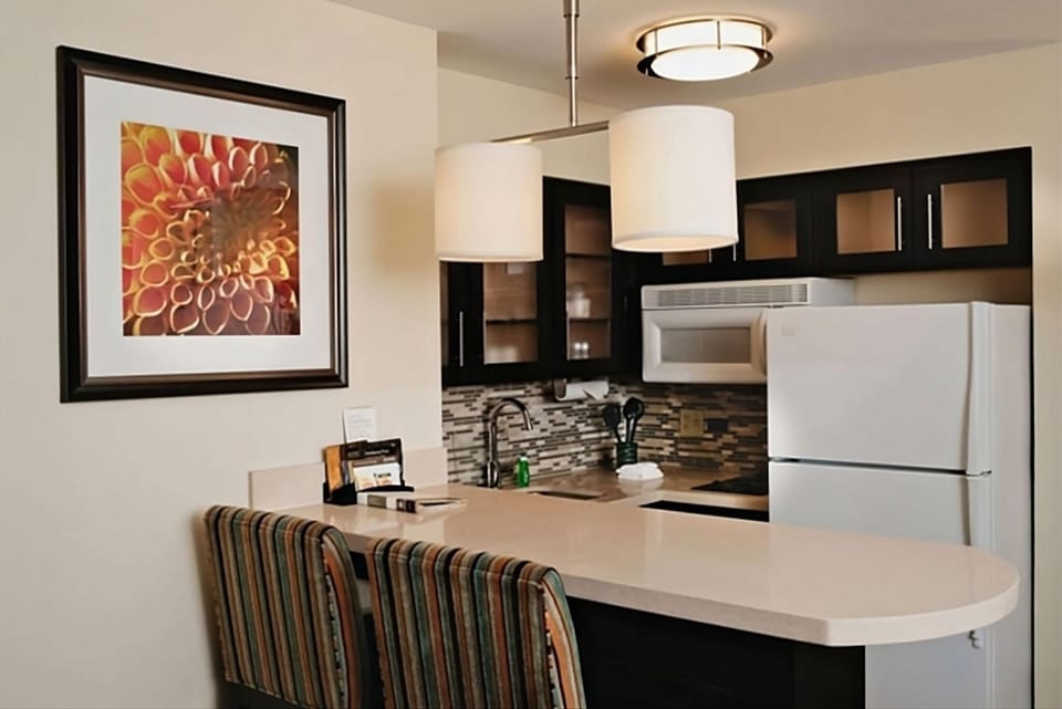 Enjoy easy meals with a sleek kitchenette and breakfast bar.