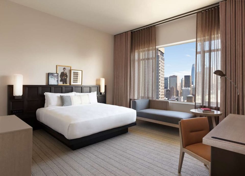 Soak in sweeping city views from the comfort of bed.