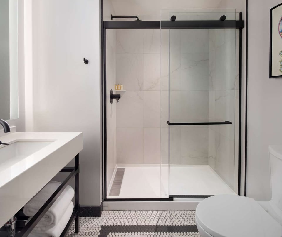 Refresh in a sleek glass shower with spa-like calm.
