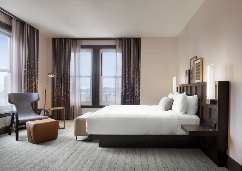 Relax in a serene corner room with calming natural light.