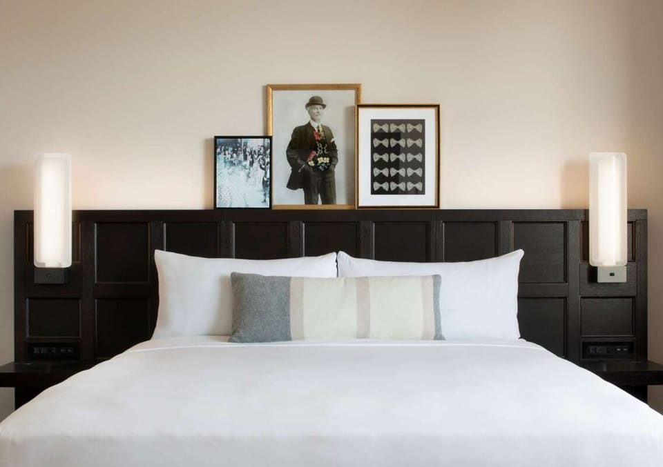 Drift off beneath warm sconces and boutique-style bedding.
