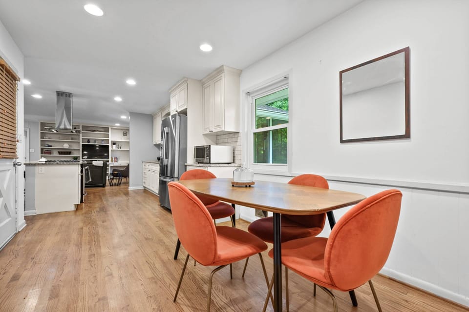 Breakfast nook, the door to the left goes into the garage. Check out these beautiful wood floors through out the house on the main floor.