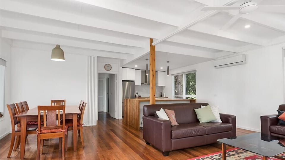 Open plan dining, kitchen and lounge area.