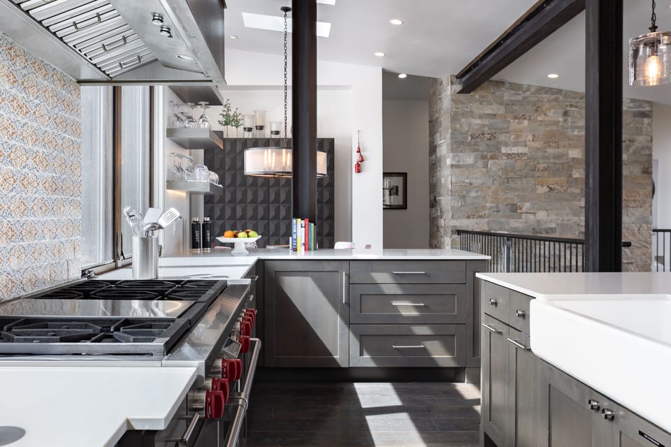 - Sleek kitchen with premium stainless steel appliances  
- Modern tile backsplash adds character and style  
- Bright counters and open shelving create a chef's dream