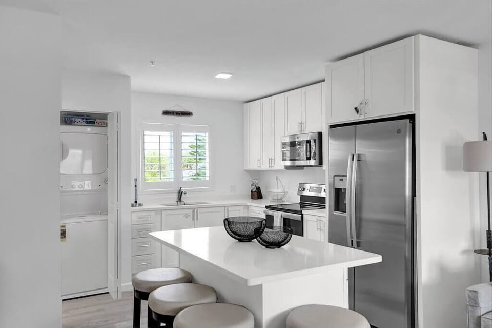 Kitchen with washer & dryer, iron & board, laundry basket