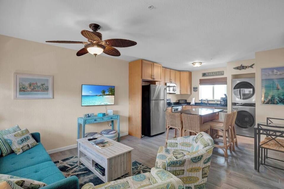 Living Room with Queen sleeper sofa; Large Kitchen Island; Dining Table