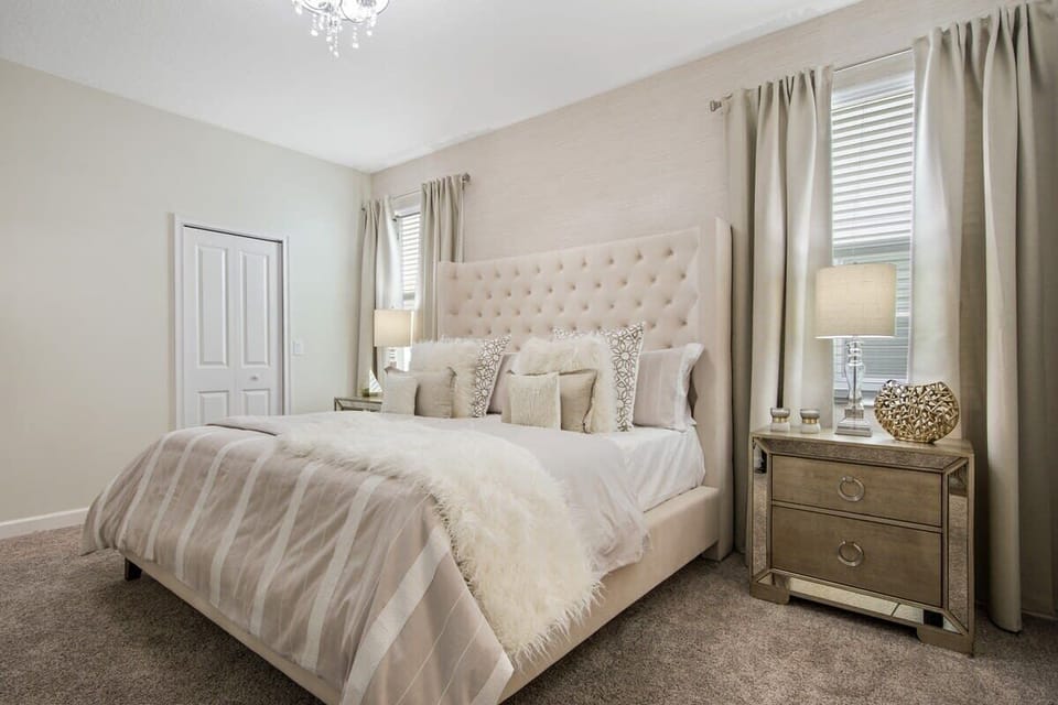 Enjoy a little extra relaxation in this spacious king bedroom featuring comfortable bedding, tasteful décor, a flat-screen TV, and high-speed Wi-Fi—your own peaceful retreat during your vacation.