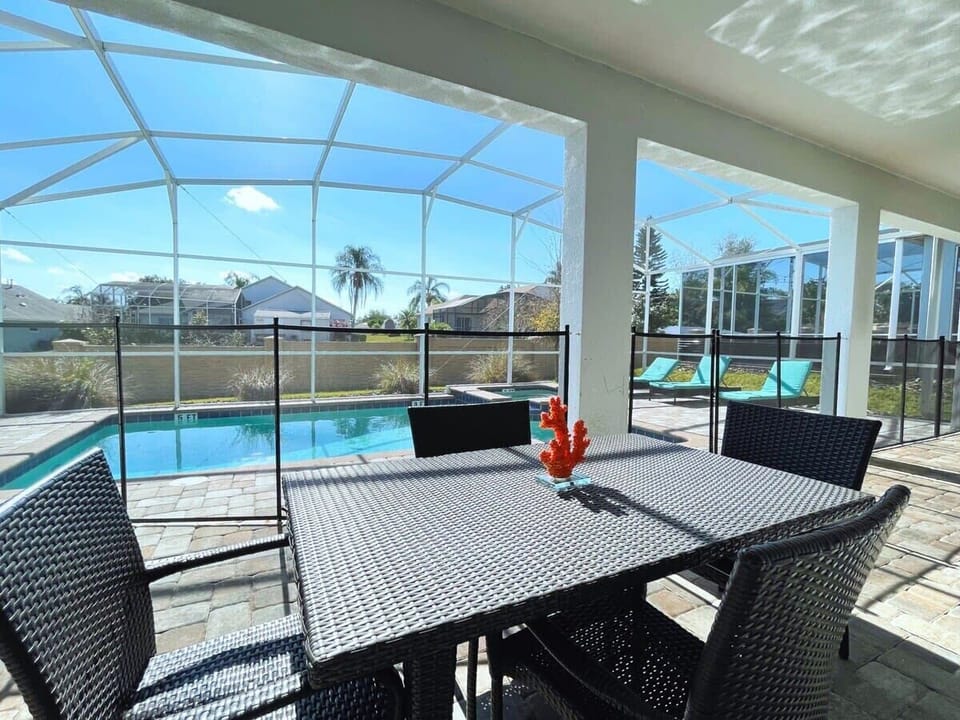 Outdoor seating by the pool and spa