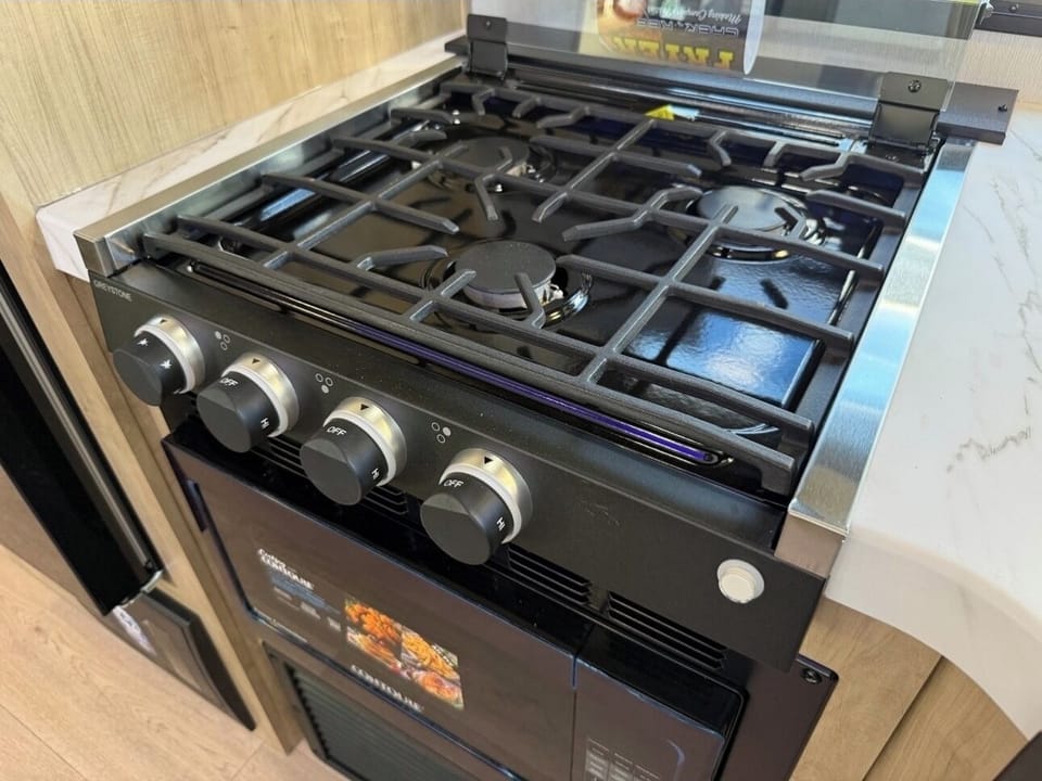 Covered 3 burner propane stovetop.