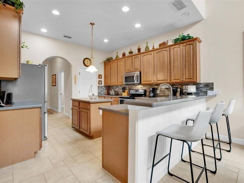 Fully equipped kitchen with modern appliances and ample counter space.
