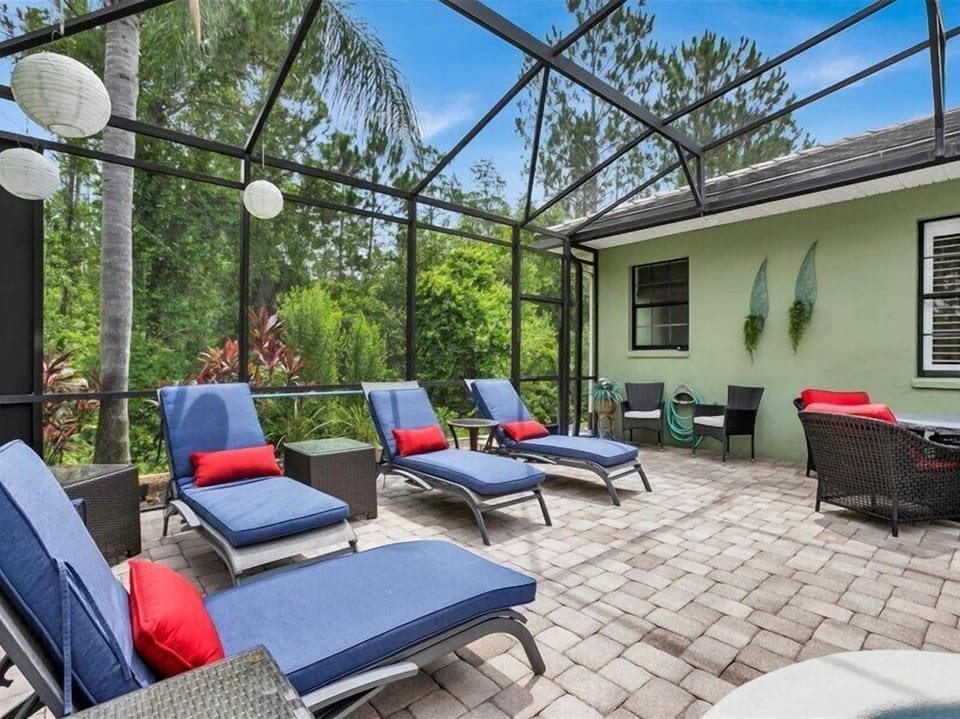 Unwind on comfortable lounge chairs in the sunlit outdoor patio.