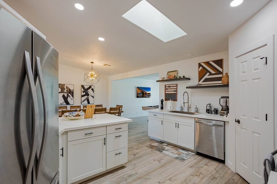 Cook a full meal for 14 without feeling like you're running a relay — island seating, stainless appliances, and enough counter space to actually spread out.