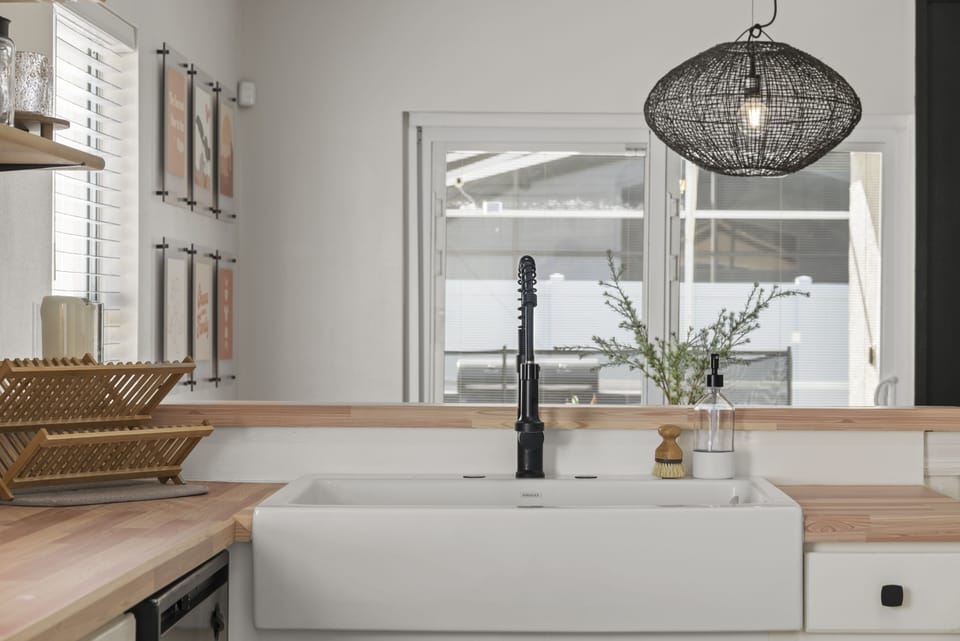 Upgraded Farmhouse kitchen sink makes washing large dinnerware so much easier!