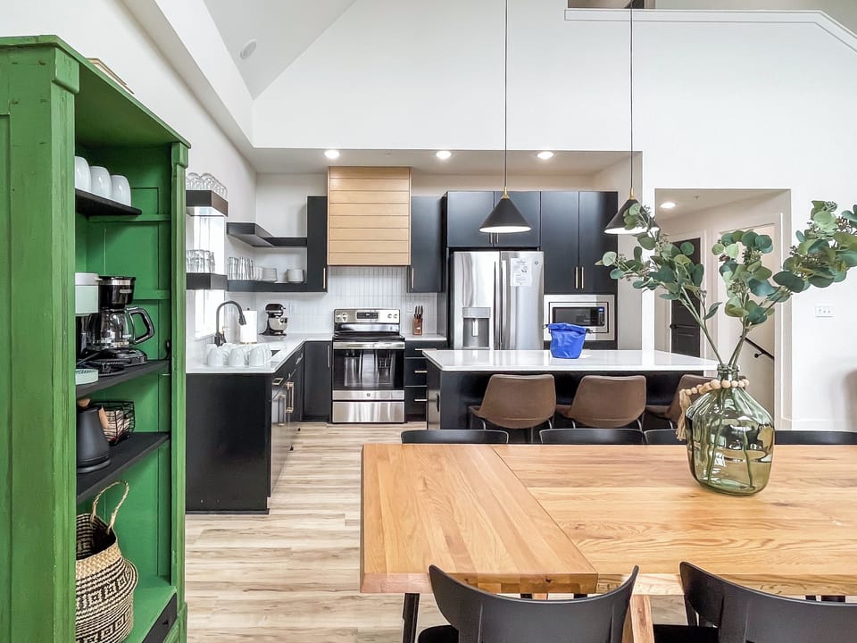 Main level open concept dining and kitchen with abundant seating