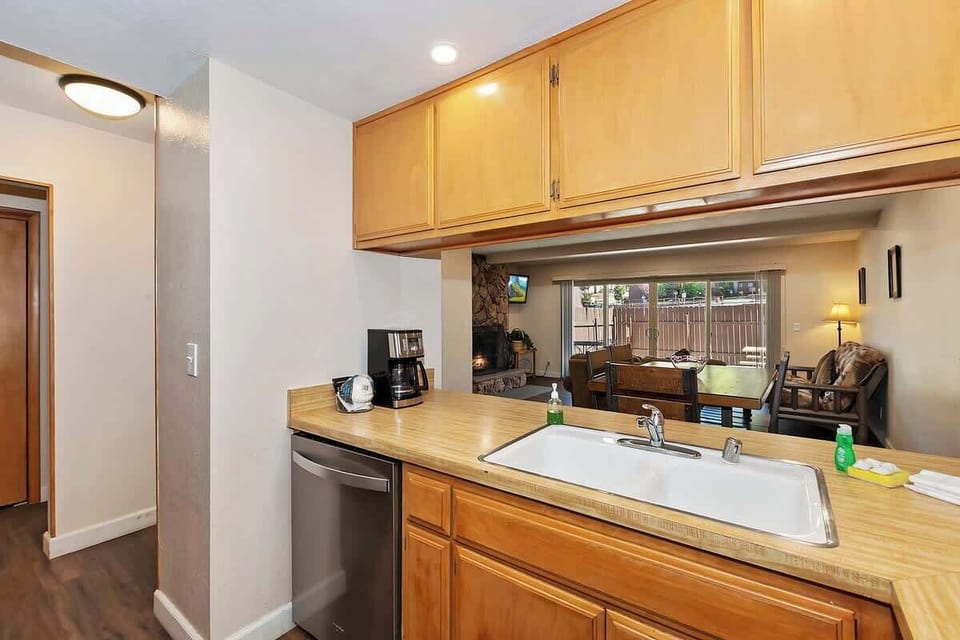 Kitchen, dining table and living room view. 