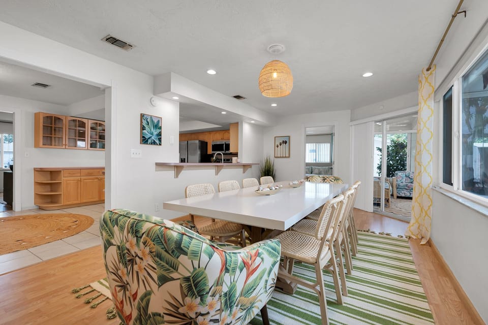 Large open dining room with a pass through to the kitchen! 10 person table.