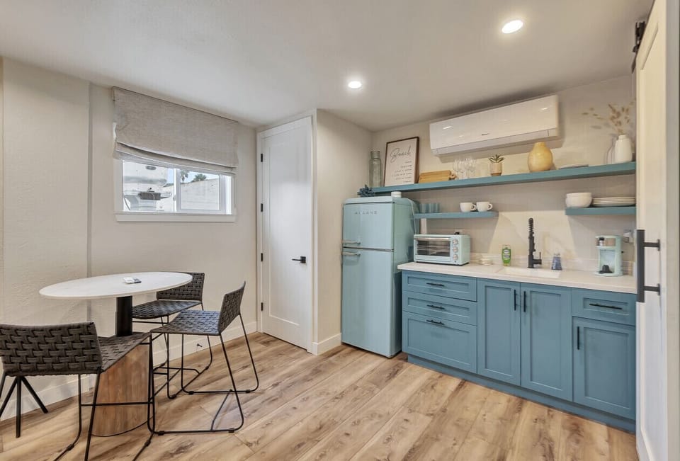 Compact kitchenette w/ table & chairs, ideal for easy meals indoors