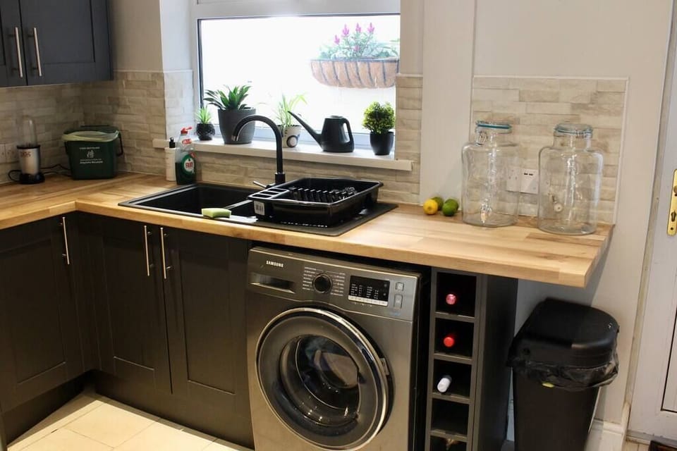 The kitchen is new and tidy and clean.