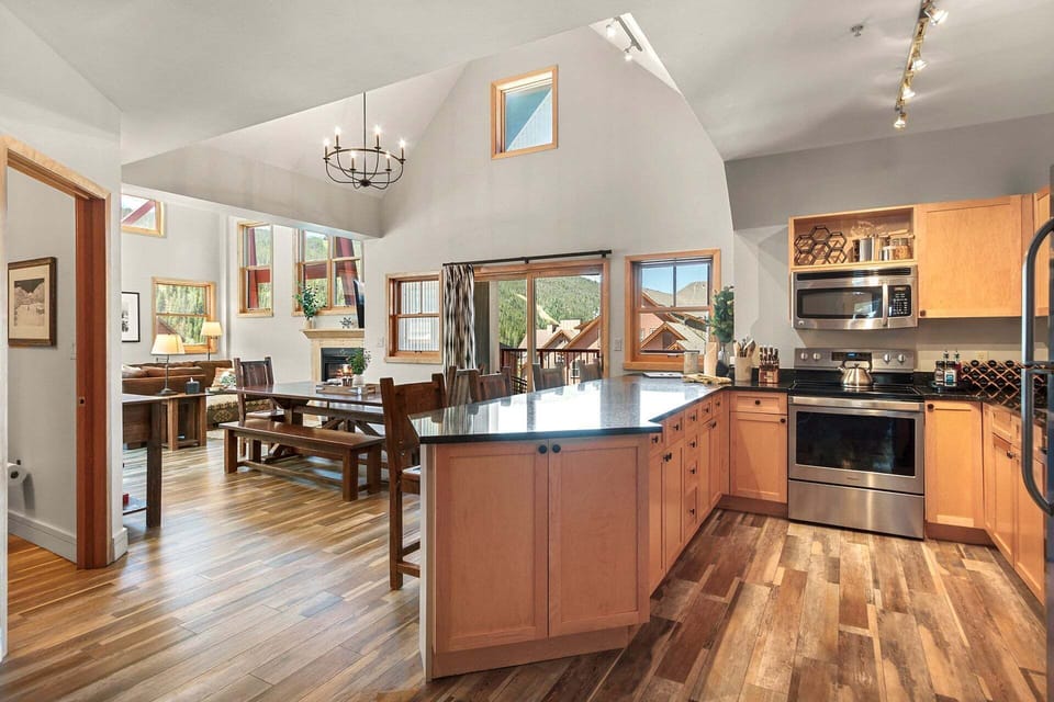 Chef's Kitchen — Fully stocked and designed for gatherings—prep meals for 12 with a village-view backdrop. 🍳✨