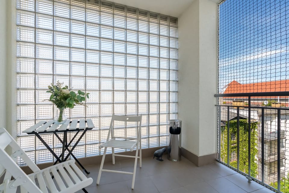 View of the balcony with garden furniture.