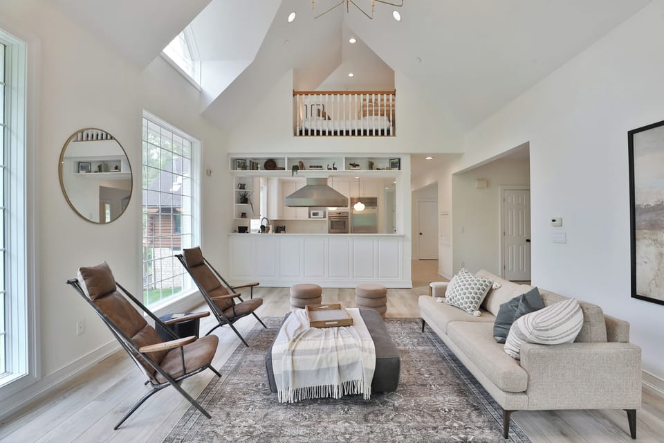 High ceiling main living room area with lake views. Main Floor (no stairs).