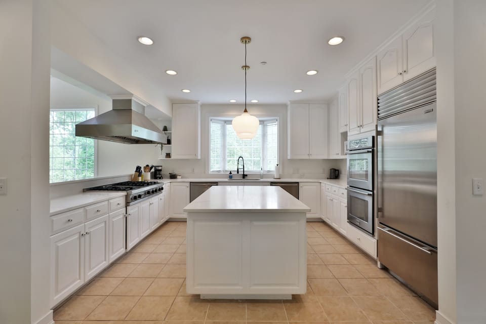 Open kitchen with updated appliances connected to main living area. 
(no stairs)