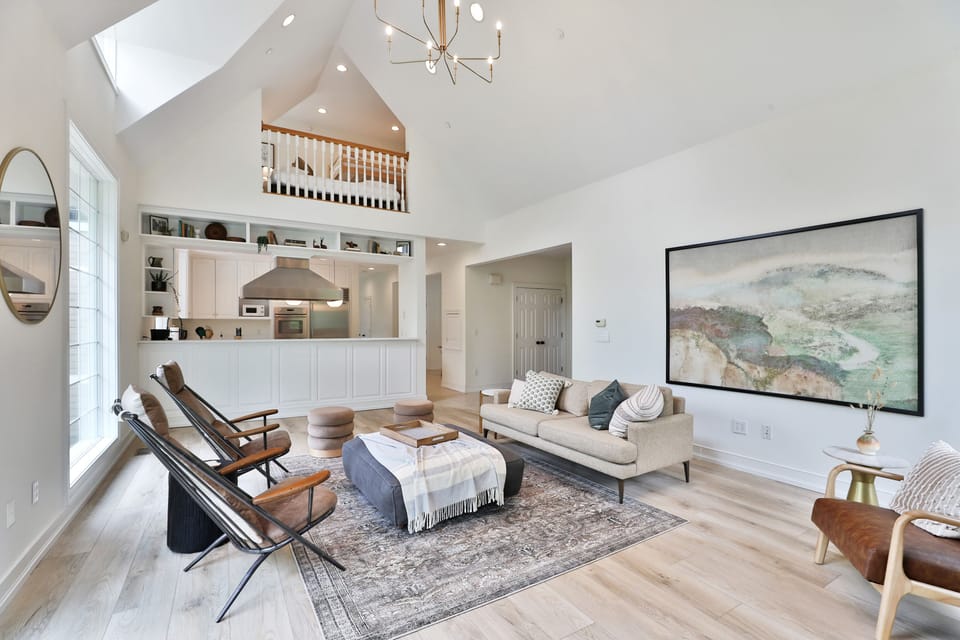 High ceiling main living room area with lake views. Main Floor (no stairs).