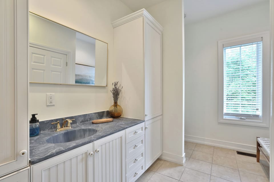 Half bathroom off of the entryway and main living area. 