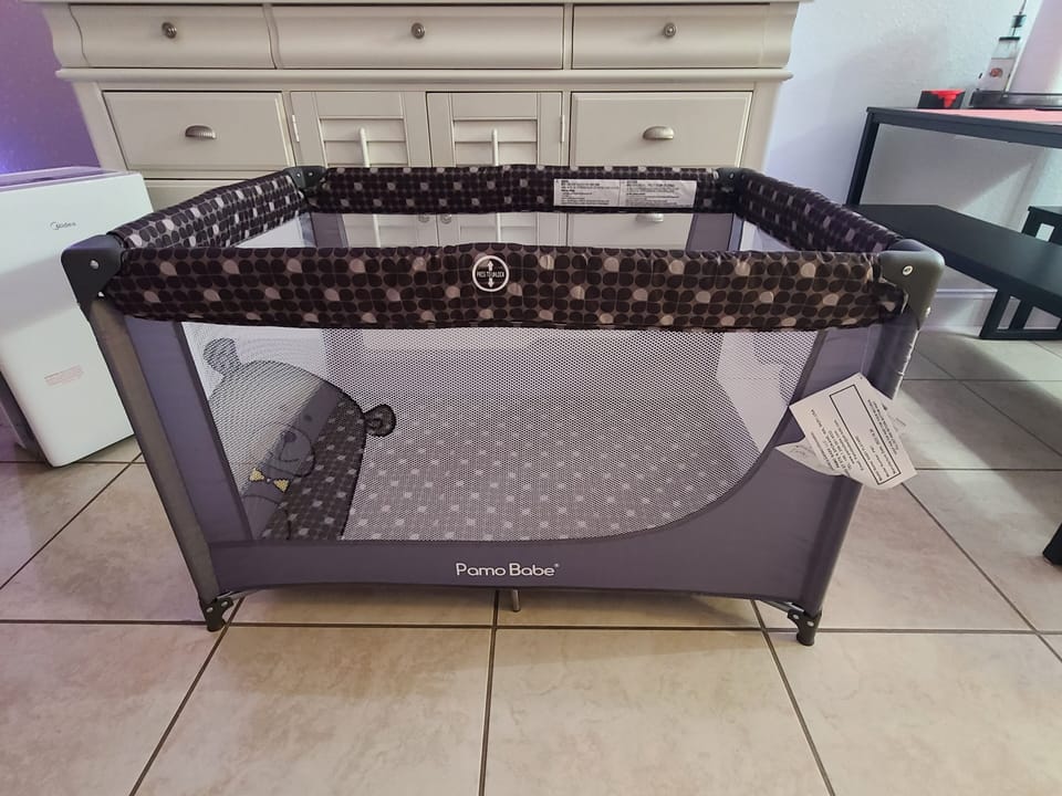 Portable Crib Baby Playpen with a matrass and carry bag.