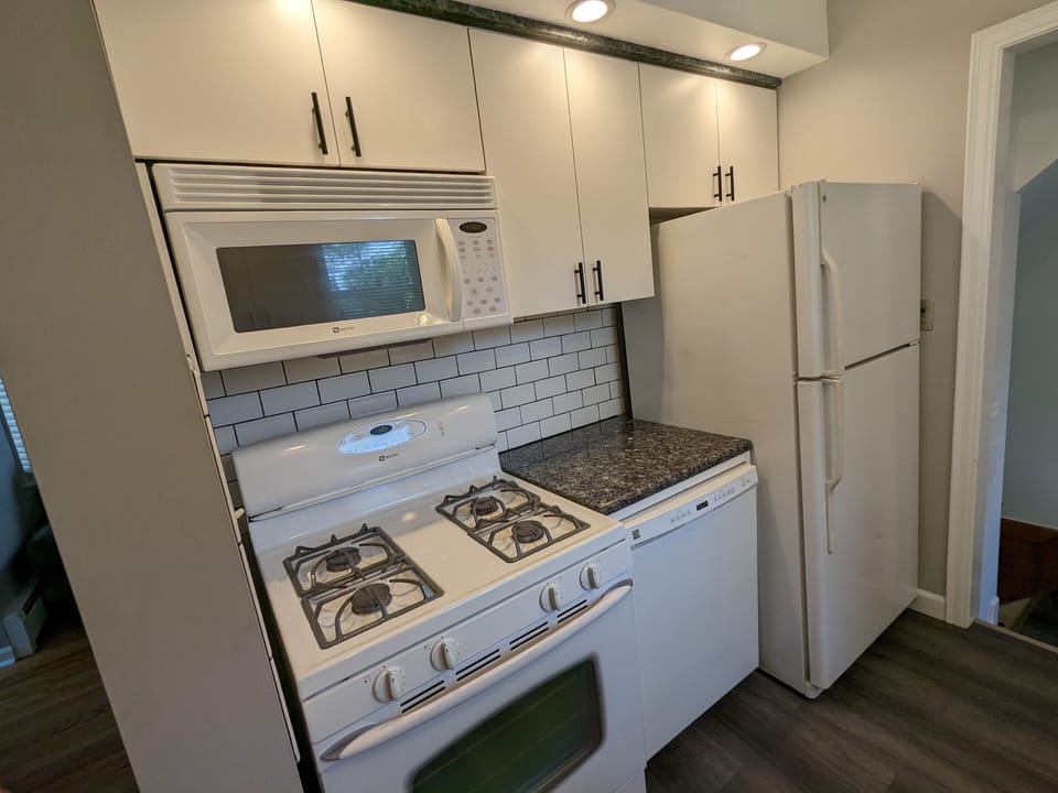 Fully stocked kitchen with all the necessary utensils and cooking supplies