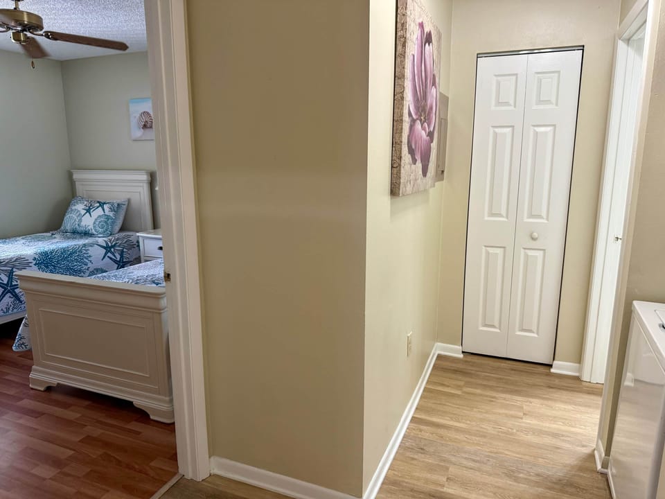 Guest bedroom with entrance to the guest bathroom 