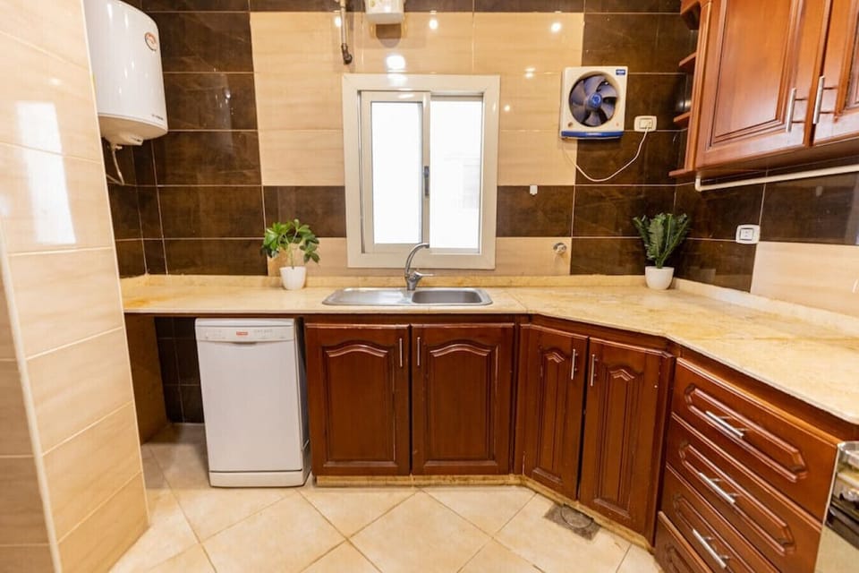 Whip up culinary delights in this modern kitchen, where every detail is designed for both style and functionality.