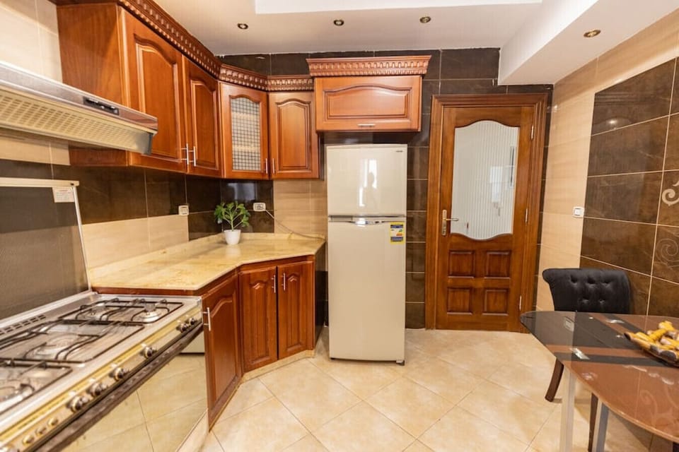 Whip up culinary delights in this modern kitchen, where every detail is designed for both style and functionality.