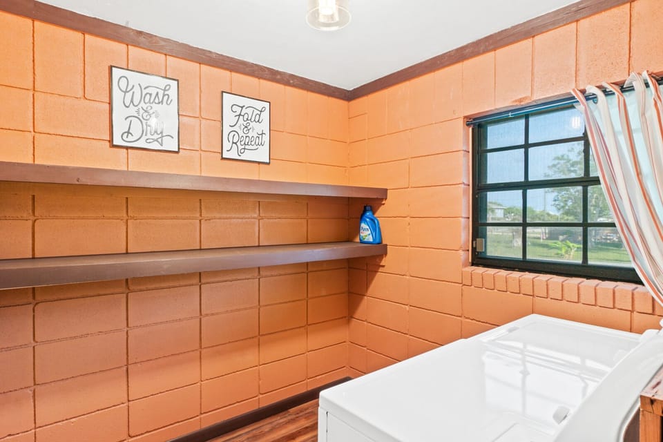 Laundry room with washer and dryer the first floor