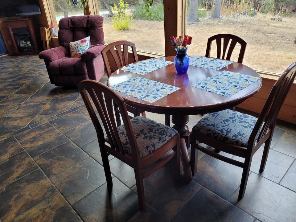 Dinning table overlooking the spacious yard