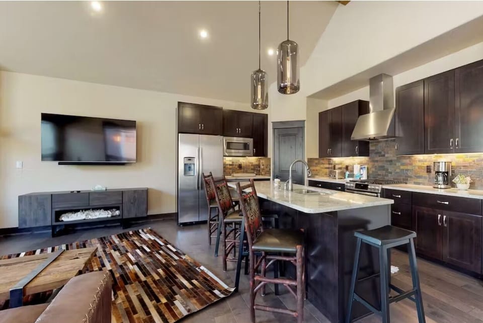 Modern kitchen with island and seating for three