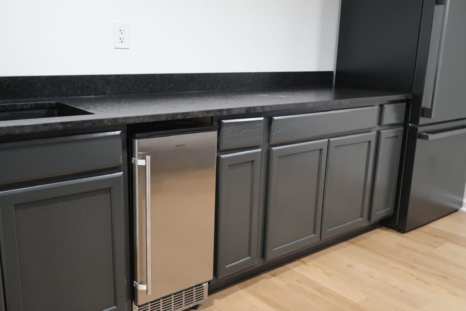 Both upstairs and downstairs have built-in bars with ice machines.