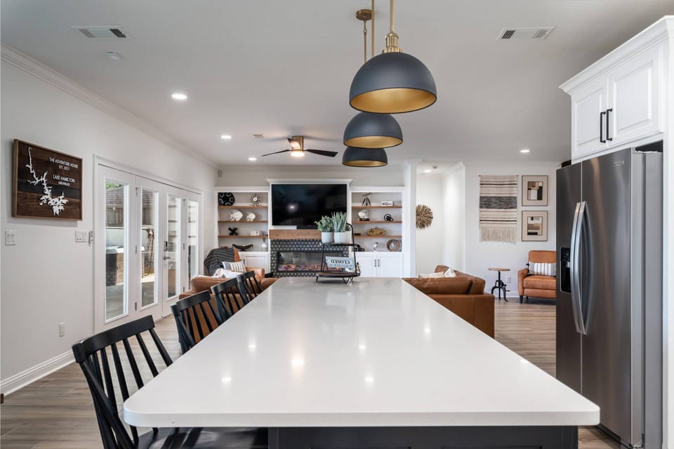 Kitchen opening into spacious living room