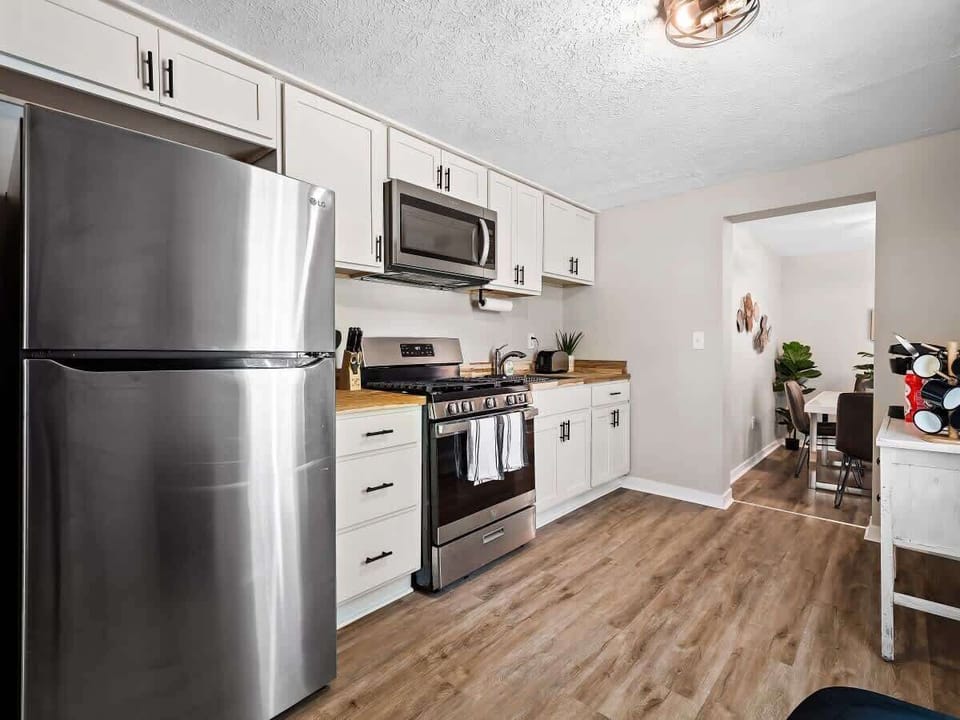 Fully equipped kitchen with stainless steel appliances, plenty of counter space, and all the essentials you need to whip up your favorite meals . Cook, dine, and feel right at home!