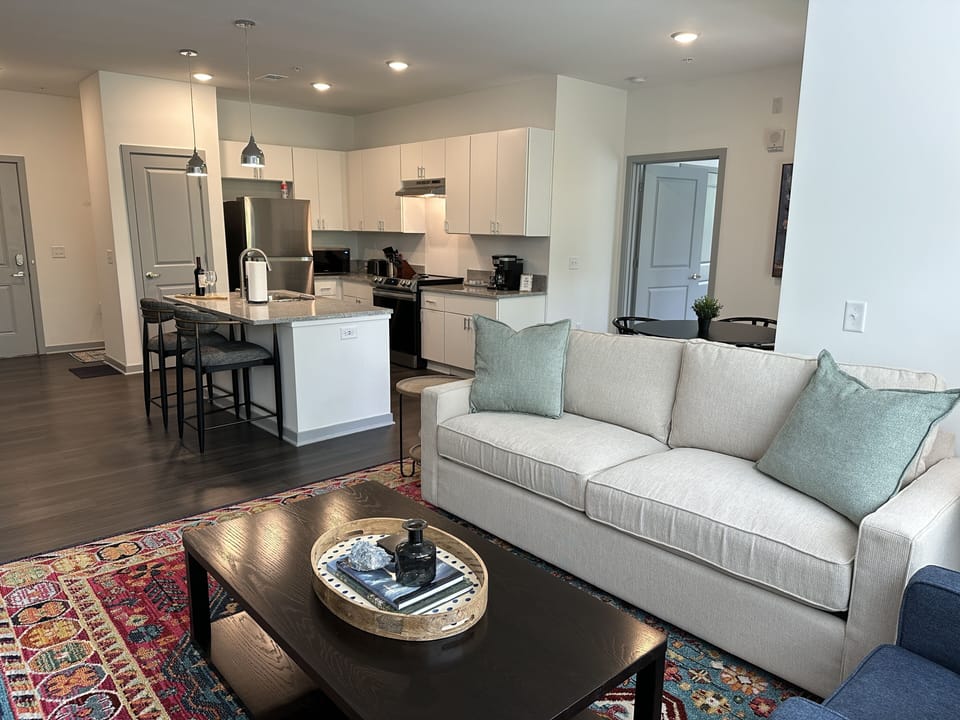 Open concept living area with Arhaus sofa 