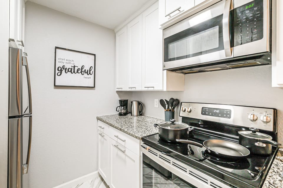 Kitchen with extra amenities:

Coffee maker, blender, microwave, toaster, flatware, dishes, drink glasses, mugs, pots, pans, cutting board, cooking utensils, dish soap, paper towels, cleaning products, oil, sugar, spices, tea, coffee, first aid...