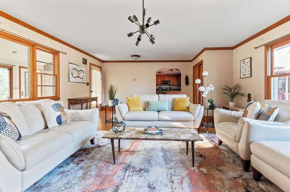 The inviting living room has plenty of seating for a group. 