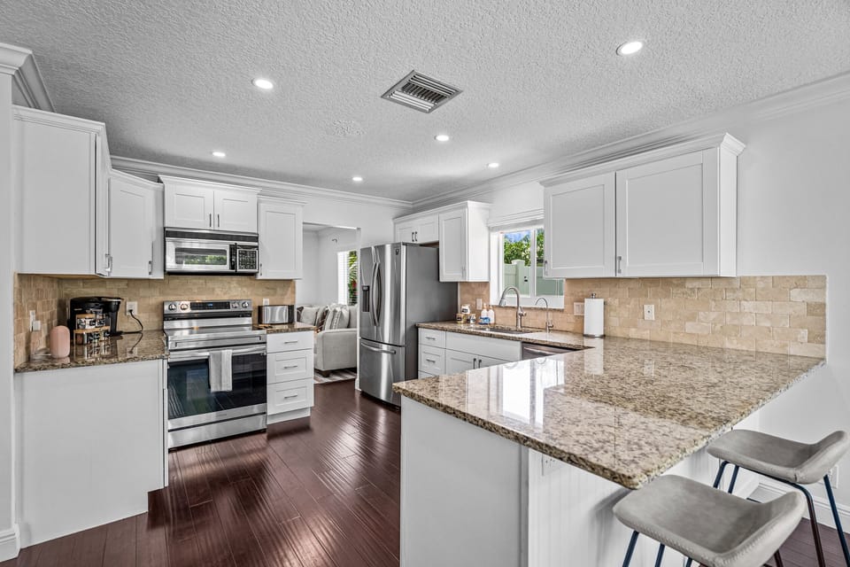 Immaculate kitchen with all the necessary items for grilling and cooking.